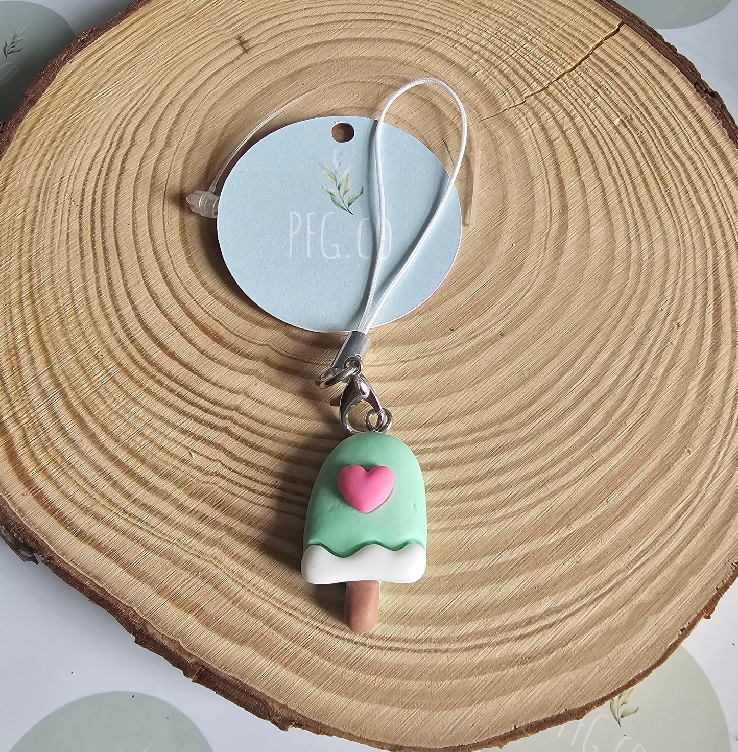 Blue lollipop phone charm