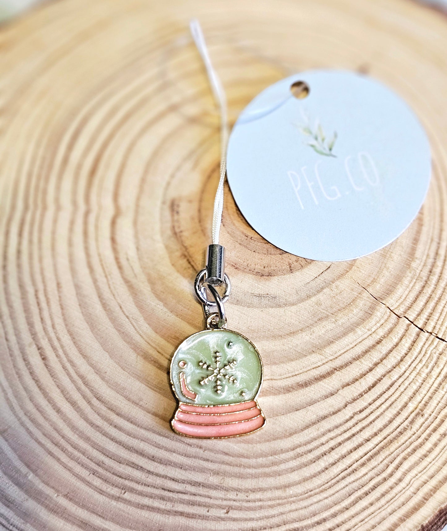 Snow globe themed phone charms.