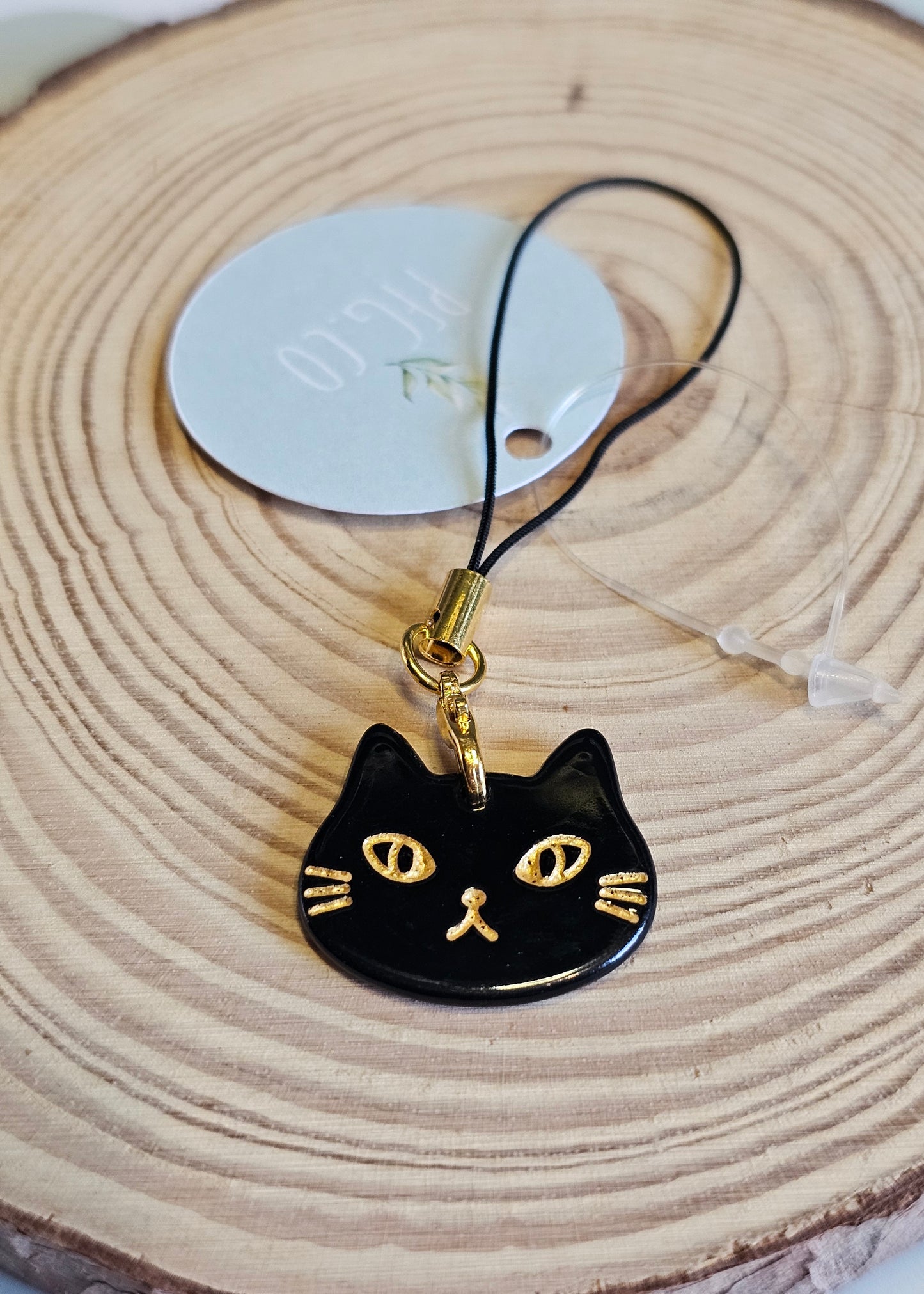 Black cat face phone charm