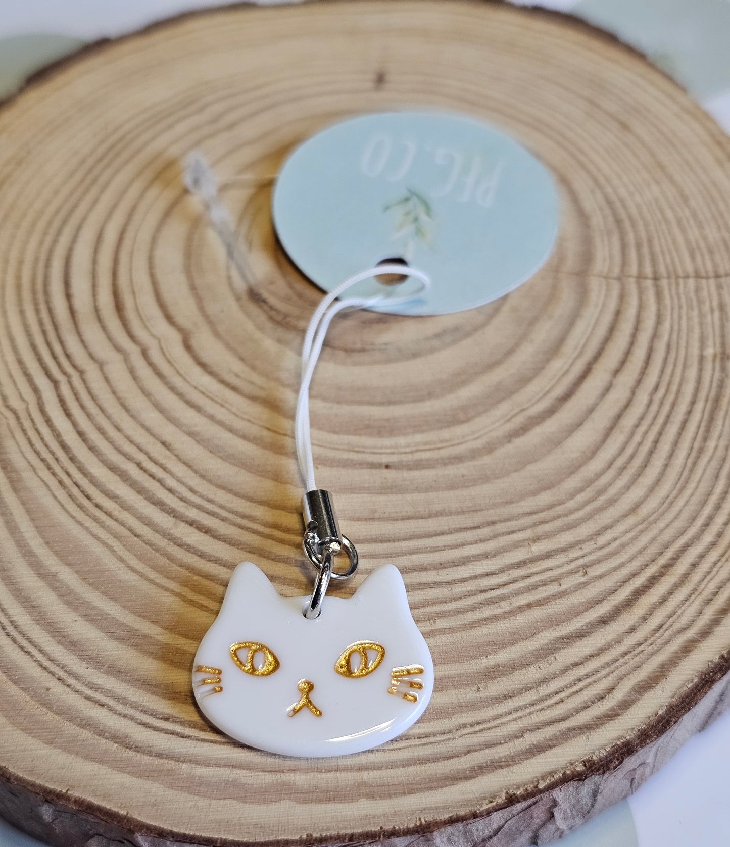 White cat face phone charm