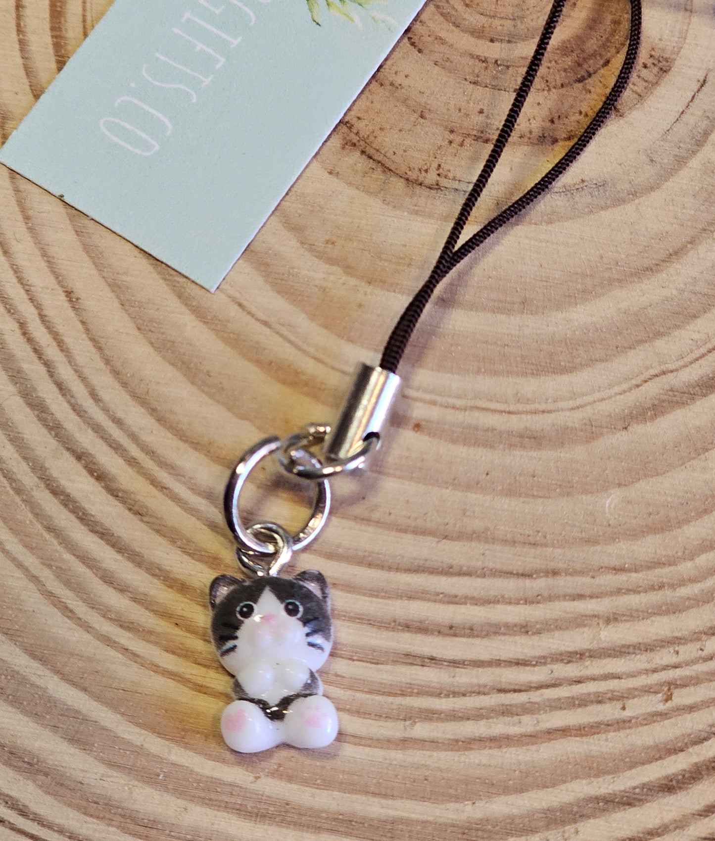 Black and white tiny cat phone with