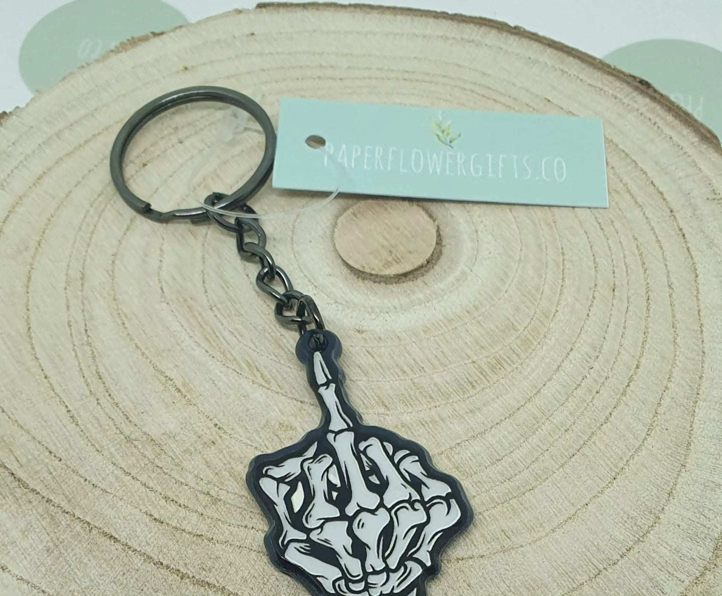 Swearing skeleton hand key ring