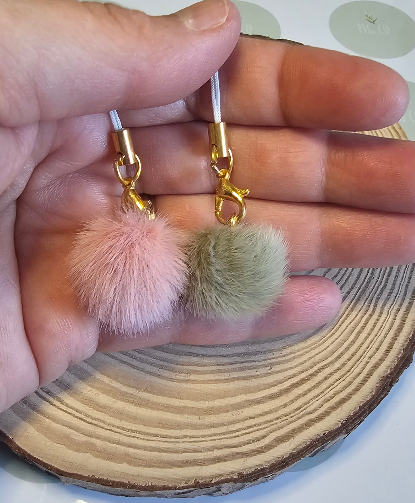 Grey pompom phone charms