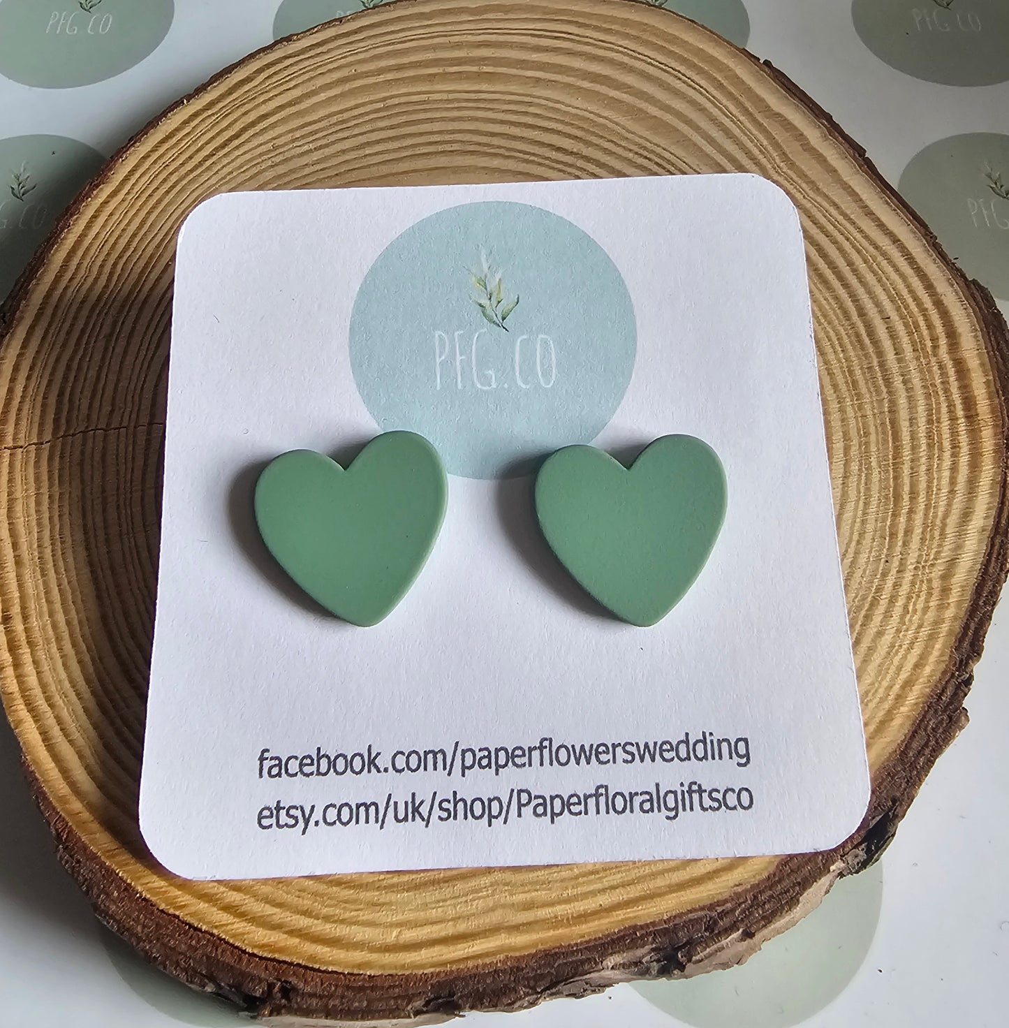 Green heart stud earrings