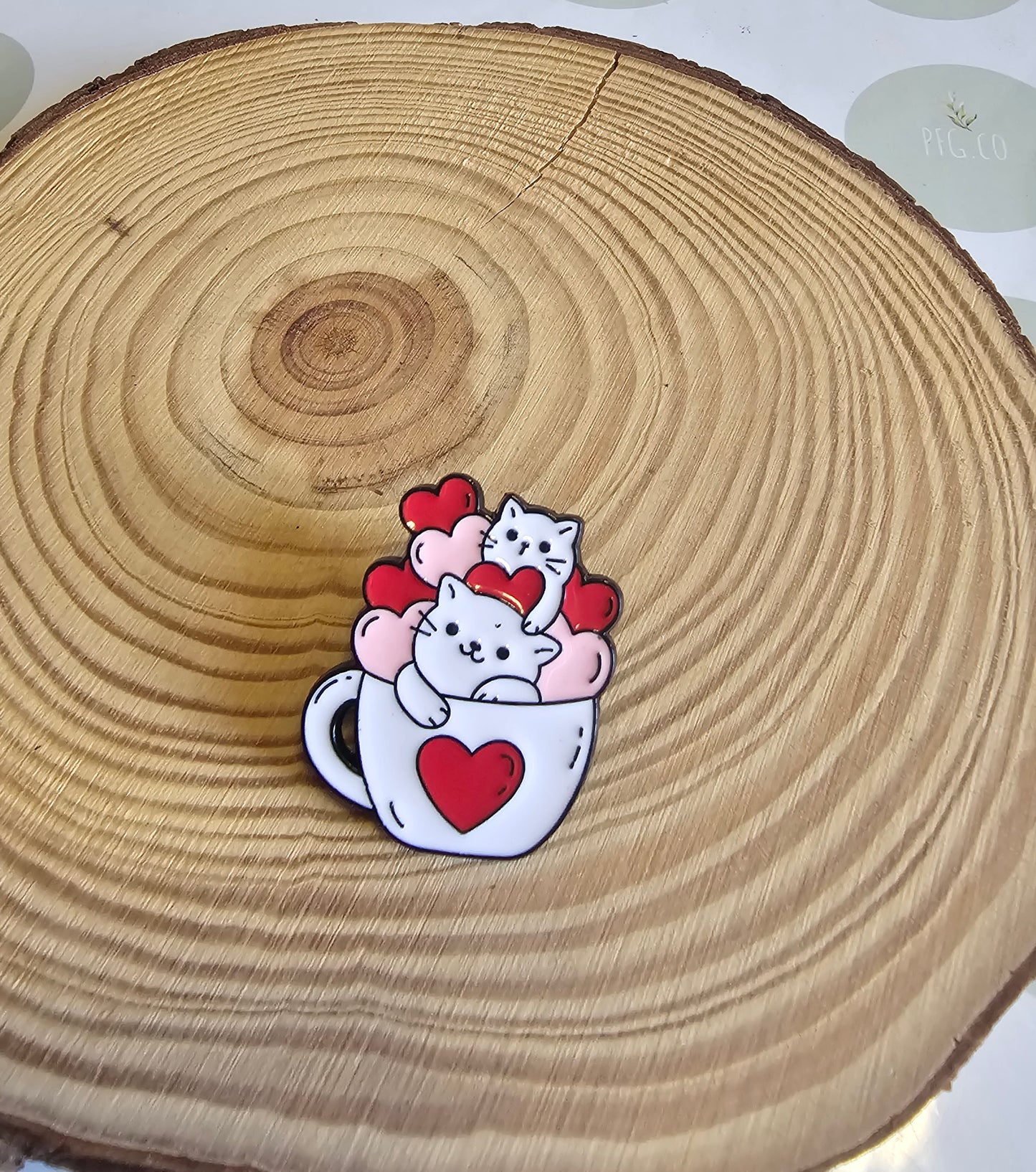 Cute kitty's in a teacup pin badge